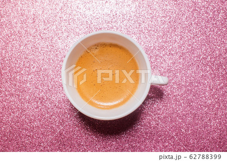 One cup hot fresh coffee on bright pink color One cup hot fresh coffee on bright pink color 62788399