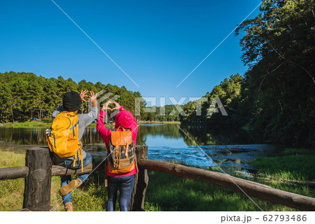 Couples travelers with backpack happy to relax on a holiday, travelers Pang-Ung park travel Couples travelers with backpack happy to relax on a holiday, travelers Pang-Ung park travel 62793486