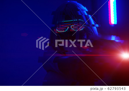 Girl with blaster in the futuristic battle. Concept virtual reality, cyber game. Image with glitch effect. 62793543