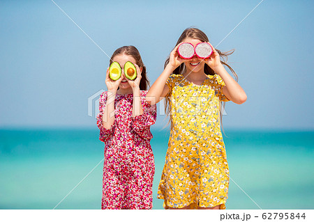 Cute little girls at beach during summer vacation 62795844