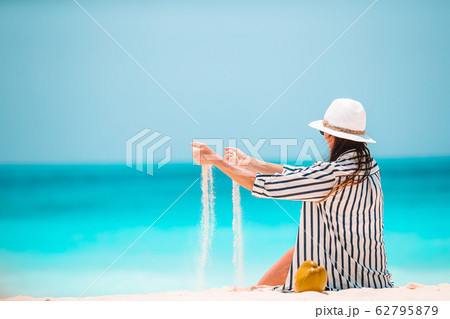 Young beautiful woman on beach tropical vacation 62795879