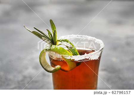 Glass with alcohol, salt and lime on a dark Glass with alcohol, salt and lime on a dark 62796157