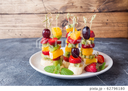 Fresh fruit on skewers. Concept buffet for a Fresh fruit on skewers. Concept buffet for a 62796180