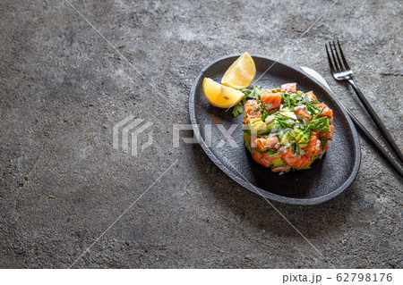 PERUVIAN NIKKEI FOOD. Salmon avocado ceviche on PERUVIAN NIKKEI FOOD. Salmon avocado ceviche on 62798176