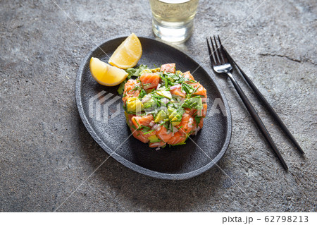 PERUVIAN NIKKEI FOOD. Salmon avocado ceviche on 62798213