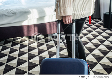 hotel visitor with a suitcase in the hotel room hotel visitor with a suitcase in the hotel room 62800269