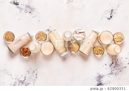 A bottles of alternative  milk and ingredients. 62800351