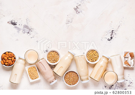 A bottles of alternative  milk and ingredients. 62800353