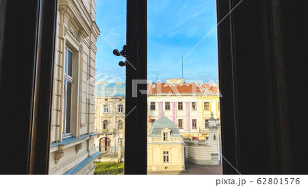 View of the courtyard through a large window. View of the courtyard through a large window. 62801576