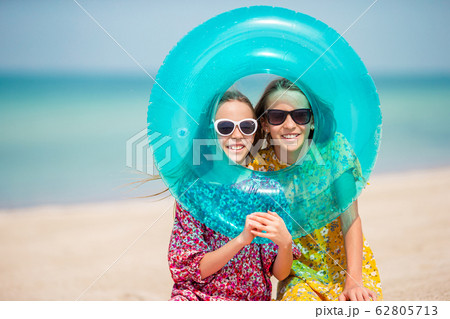 Adorable little girls during summer vacation have fun together Adorable little girls during summer vacation have fun together 62805713