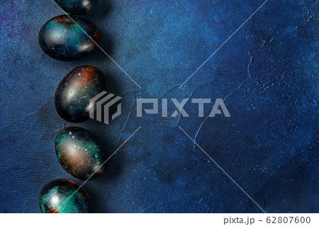 Easter eggs on blue background. Copy space 62807600