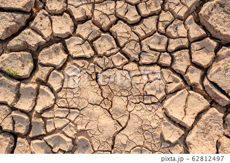Dry soil results from lack of water.Global warming 62812497