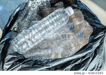 Closeup plastic bottles in trash bag, Global environment problem 62813365