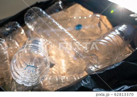 Closeup plastic bottles in trash bag, Global environment problem 62813370