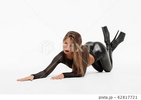 Attractive charming woman in leather suit and high 62817721