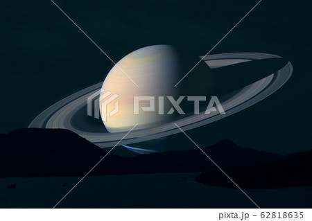 rings and saturn planet over island on the sea in 62818635
