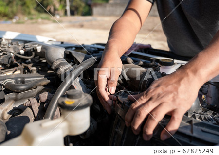 The driver is checking the car before traveling, safety first concept 62825249