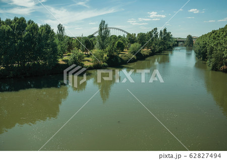Slow Guadiana River from top of Puente Romano at Merida Slow Guadiana River from top of Puente Romano at Merida 62827494