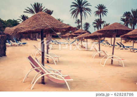 Focus on parasol. Sunbeds on snow-white sand 62828786