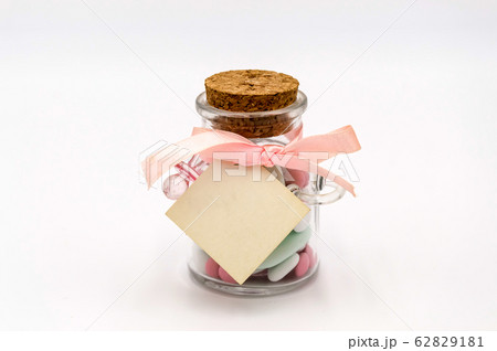 Colorful sweet almonds in a glass container with a 62829181