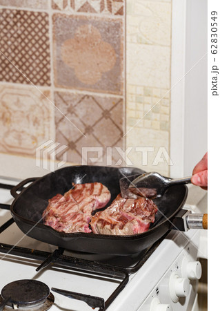 Raw beef steak in grill pan 62830549