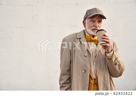 Calm old man with cup of coffee stock photo Calm old man with cup of coffee stock photo 62832622
