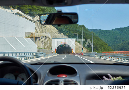 Car approaching a tunnel 62836925
