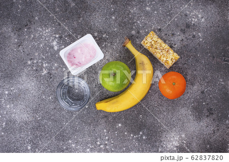 Apple, yogurt, banana and granola bar Apple, yogurt, banana and granola bar 62837820