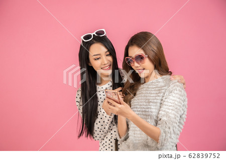 Portrait of two cute Asian women with black hair 62839752