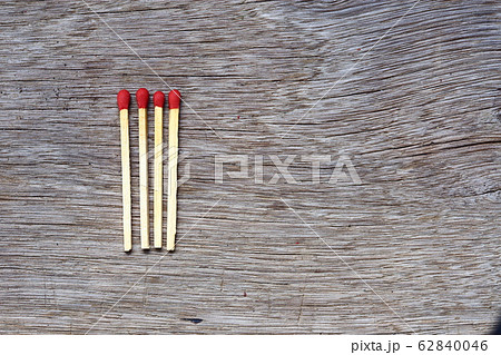four pile of fire match arrange in a row on a wood four pile of fire match arrange in a row on a wood 62840046