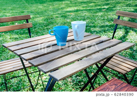 Tea time in house garden. 62840390