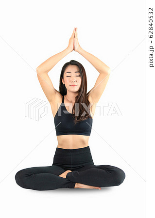 Young attractive smiling woman practicing yoga, 62840532
