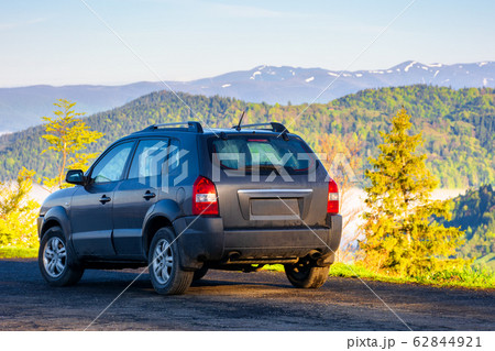 suv on the edge of a mountain 62844921