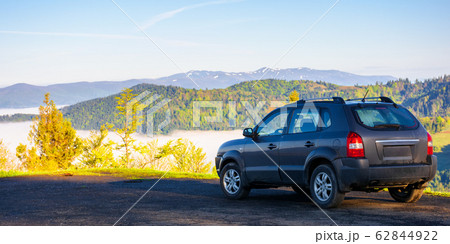 suv on the edge of a mountain suv on the edge of a mountain 62844922