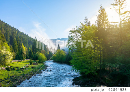 mountain river on a misty sunrise mountain river on a misty sunrise 62844923