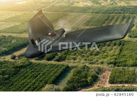 Agricultural drone flies over the field. Smart farming and digital transformation in agriculture. 62845160