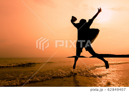 Happy young woman jumping on beach, Relaxing woman Happy young woman jumping on beach, Relaxing woman 62849407