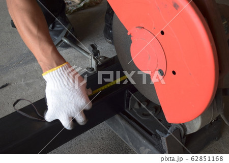 Men use length measuring tools to cut steel  62851168