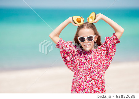 Cute little girl at beach during summer vacation Cute little girl at beach during summer vacation 62852639