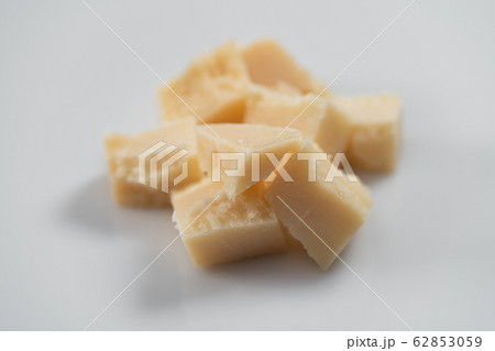 Parmesan cheese chunks on white background 62853059