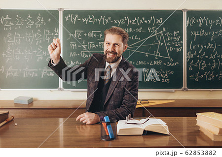 Smiling Math Teacher Encouraging the Audience During Lecture 62853882