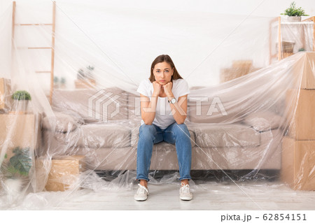 Young sad woman unhappy about new repair in her home 62854151