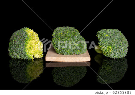 Fresh green broccoli isolated on black glass 62855385