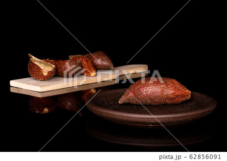 Exotic brown salak isolated on black glass 62856091