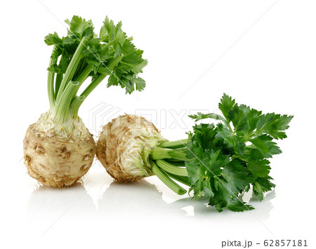 Fresh celeriac with leaves isolated Fresh celeriac with leaves isolated 62857181