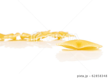 Yellow farfalle pasta isolated on white 62858348