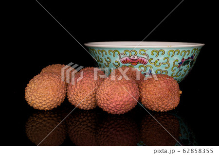 Fresh lychee fruit isolated on black glass 62858355