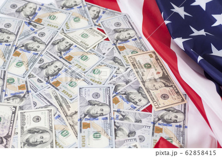 American dollars bills with flag background American dollars bills with flag background 62858415