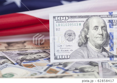 tack of dollar banknotes on American Flag 62858417