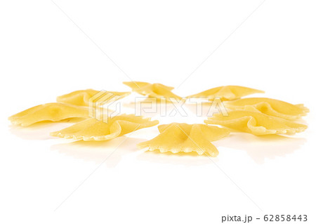 Yellow farfalle pasta isolated on white Yellow farfalle pasta isolated on white 62858443